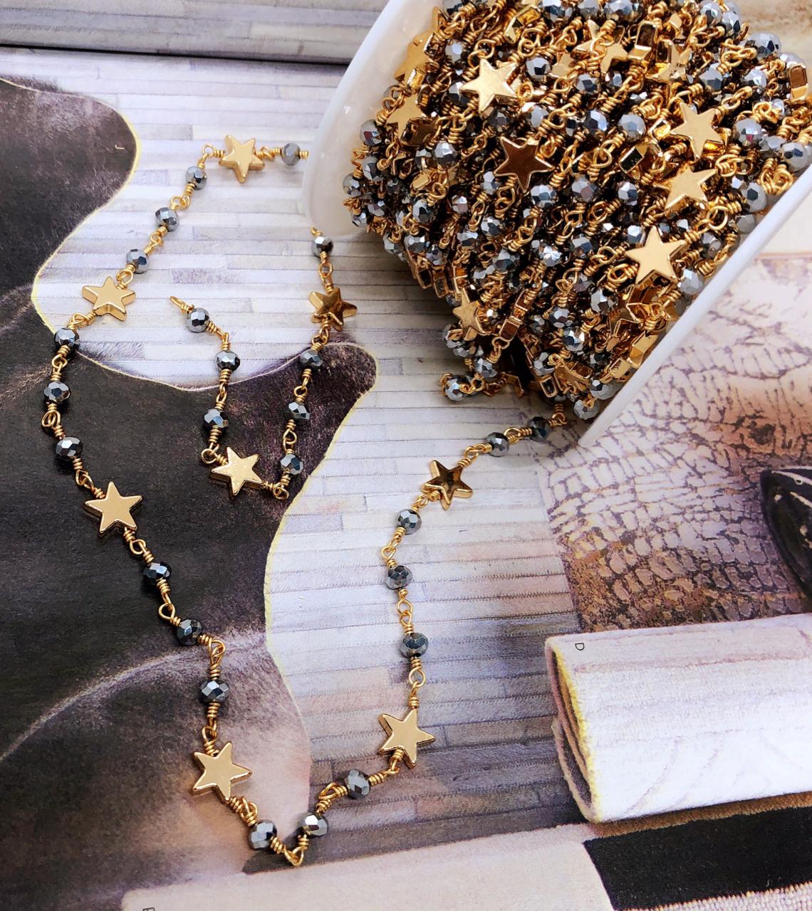 CADENA GOLDPLATED CON ESTRELLAS Y CRISTAL RONDEL 2MM ROLLO 10MTS