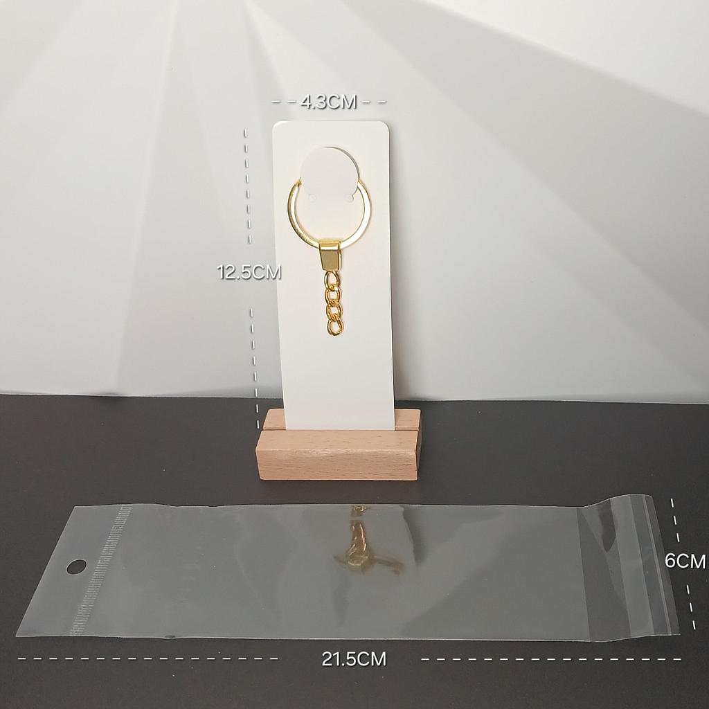 CARTON Y BOLSA CON PEGAMENTO PARA LLAVERO 6PCS